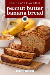 Sliced loaf of peanut butter banana bread set on a wooden board. Text overlay includes recipe name.