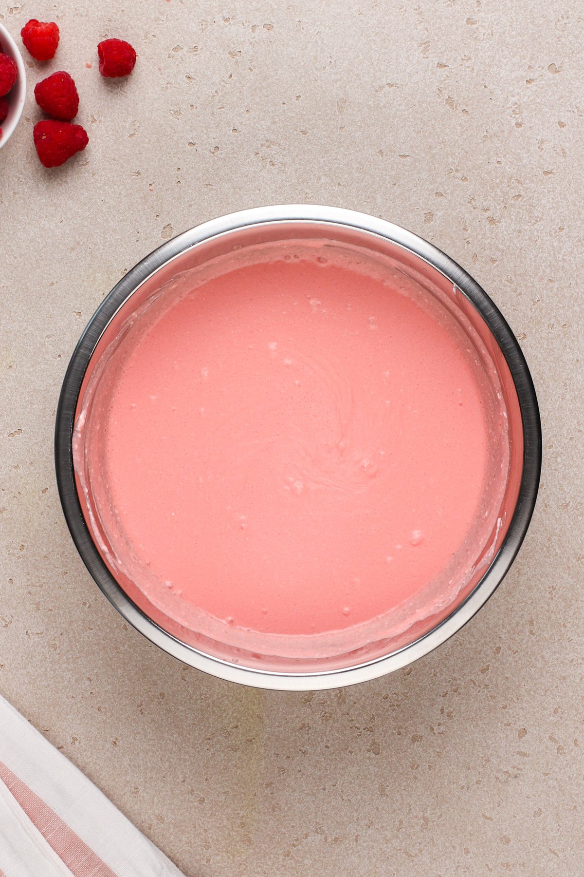 Jello pie filling mixed in a metal bowl.