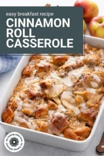 White baking dish filled with cinnamon roll casserole. Text overlay includes recipe name.