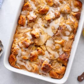 Overhead view of cinnamon roll casserole in a white pan.