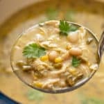 Ladleful of white chicken chili.