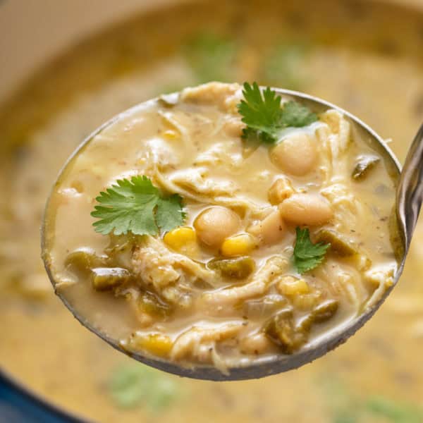 Ladleful of white chicken chili.