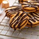 Rolo ritz cracker cookies arranged on a wire rack.