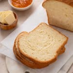 Slices of potato bread on a white cutting board.