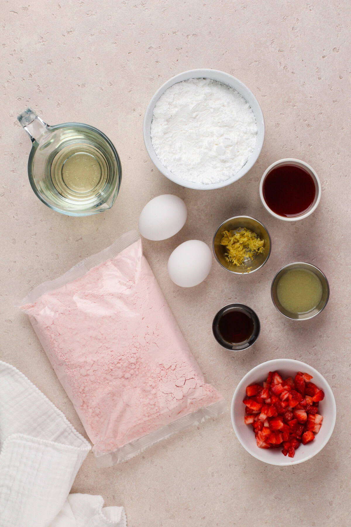 Strawberry brownie ingredients arranged on a countertop.
