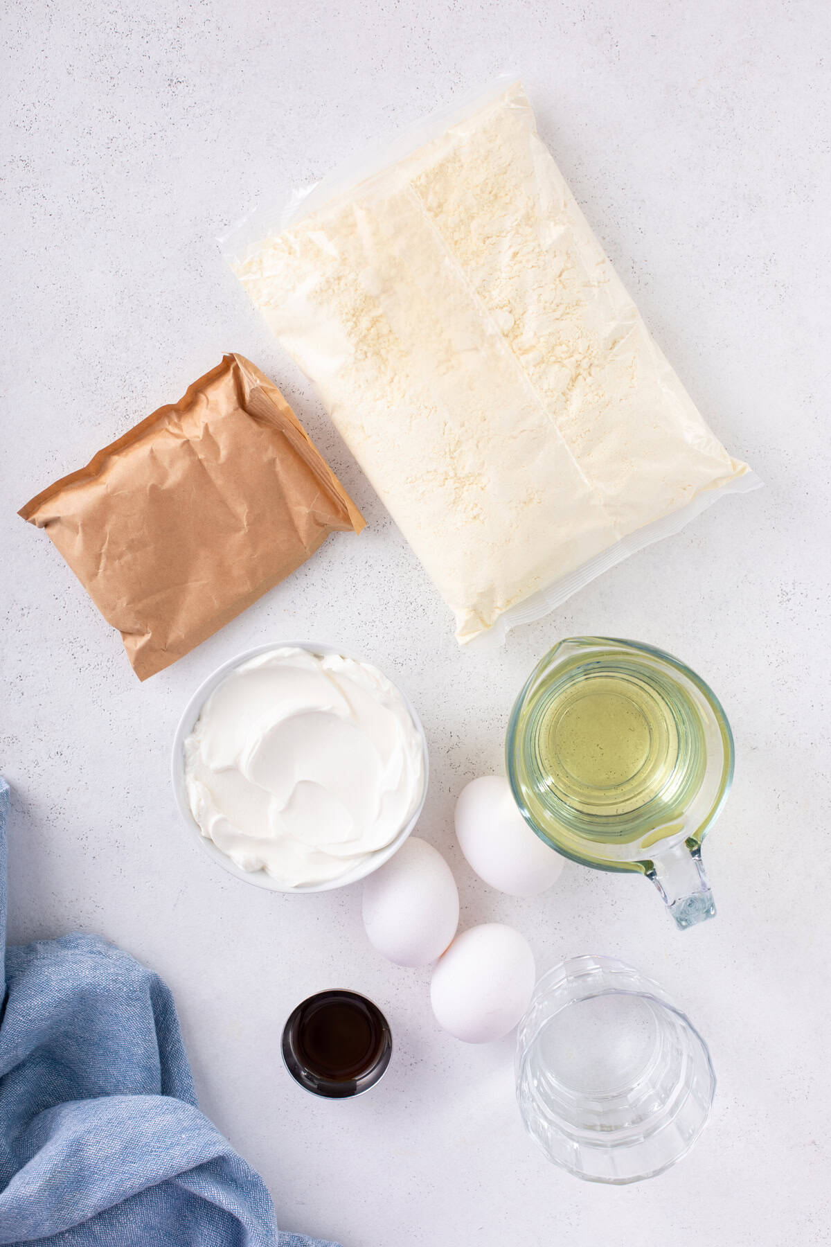 Ingredients for easy yellow cake arranged on a countertop.