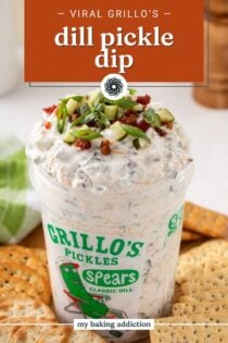 Grillo's pickle dip in a grillo's pickle container on a board surrounded by crackers. Text overlay includes recipe name.