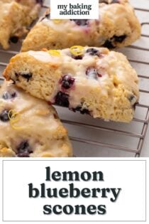 Close up of lemon blueberry scones arranged on a wire rack. Text overlay includes recipe name.