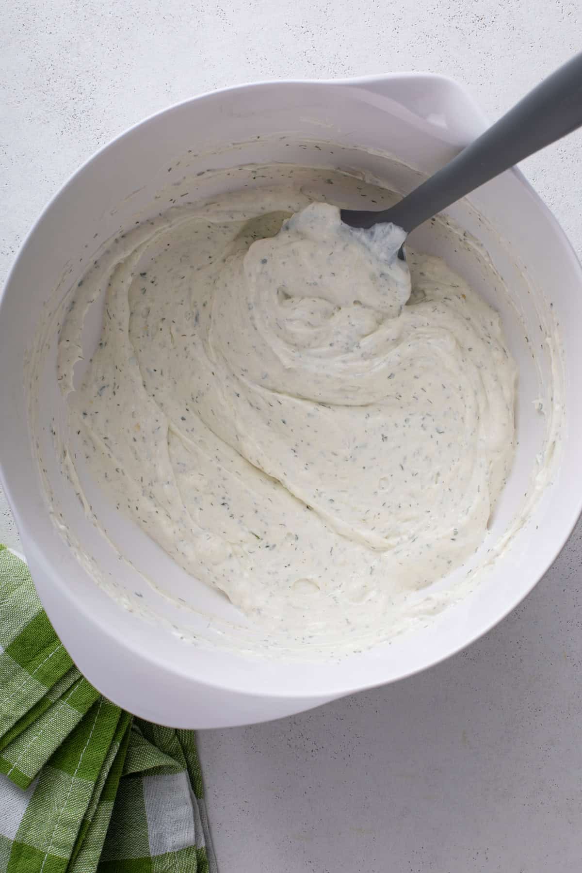 Base for pickle dip mixed in a white bowl.
