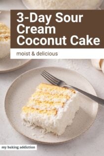 Plates of sour cream coconut cake on a countertop. Text overlay includes recipe name.