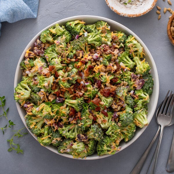 Overhead view of broccoli cranberry salad in a large serving bowl.