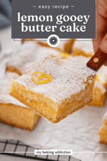 Cake server lifting up a slice of lemon gooey butter cake dusted with powdered sugar. Text overlay includes recipe name.