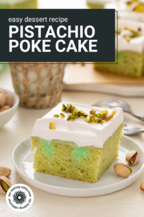 Plated slice of pistachio poke cake with a glass of milk in the background. Text overlay includes recipe name.