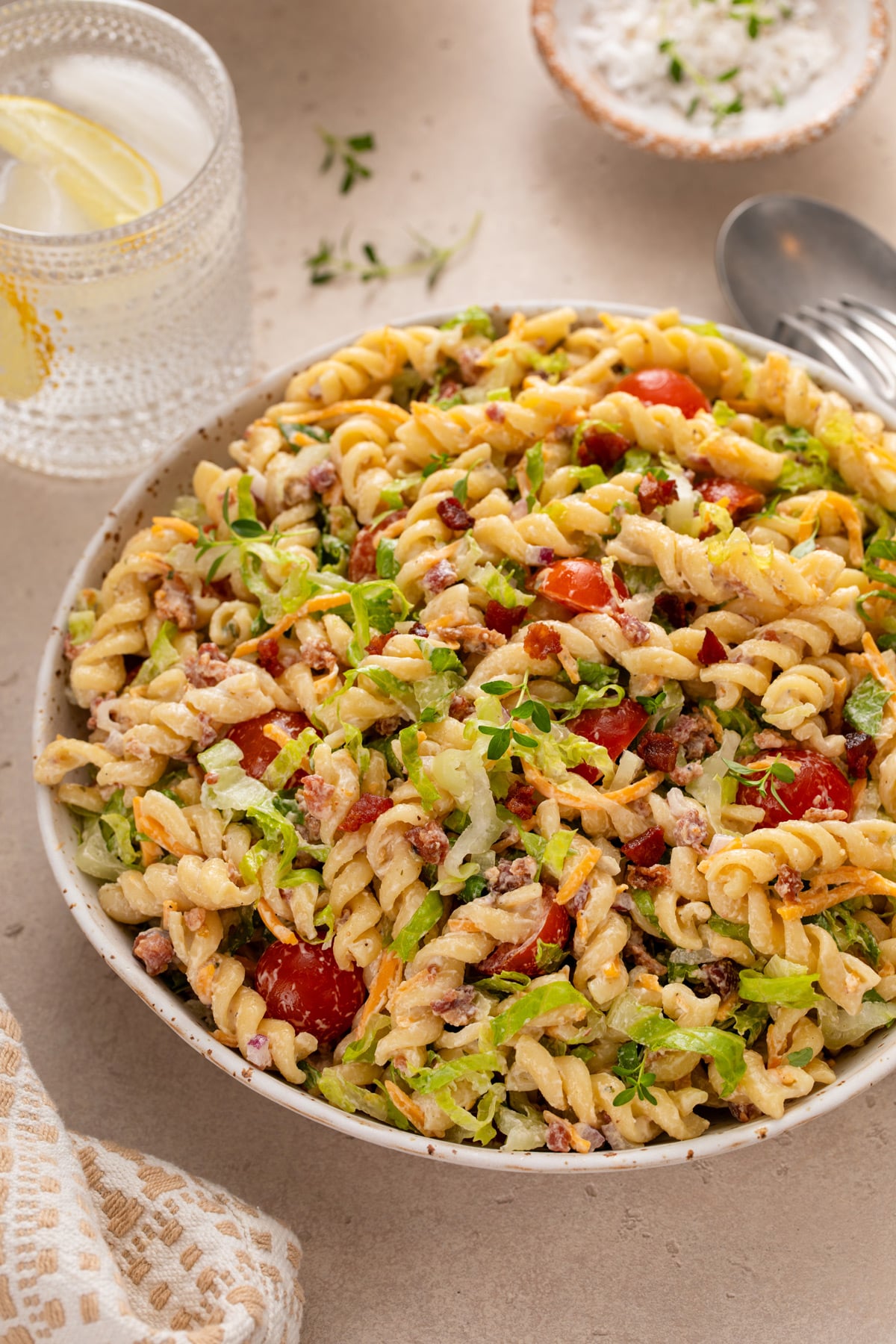 Close up of BLT pasta salad in a large serving bowl.