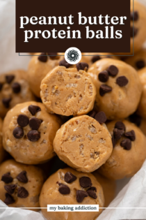 Halved peanut butter protein ball set on top of a pile of the bites. Text overlay includes recipe name.