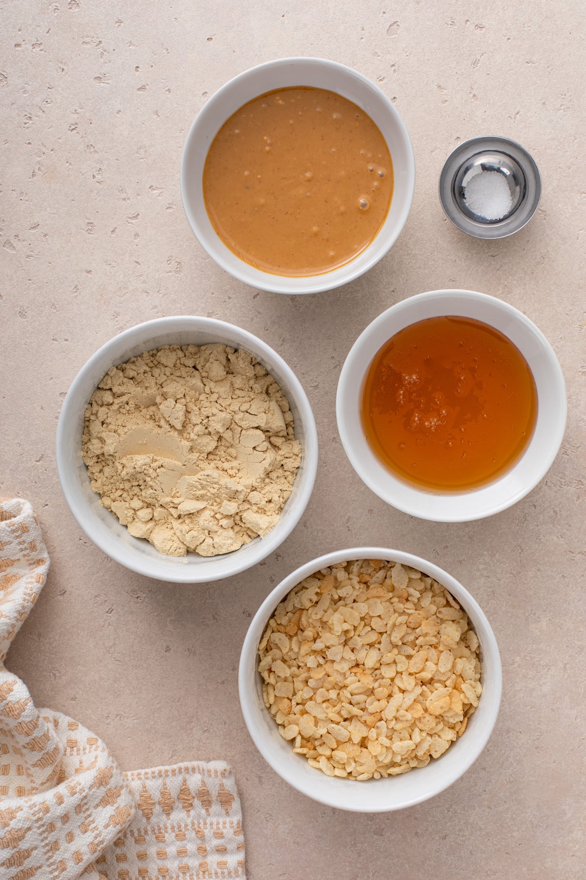 Ingredients for peanut butter protein balls arranged on a countertop.