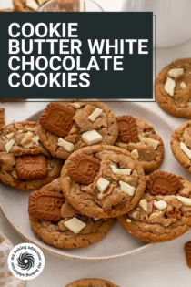 Plate filled with cookie butter cookies with a glass of milk in the background. Text overlay includes recipe name.