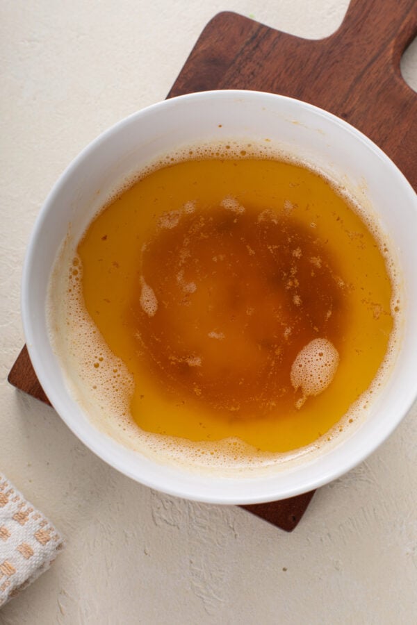 Brown butter for cookie dough in a white bowl.