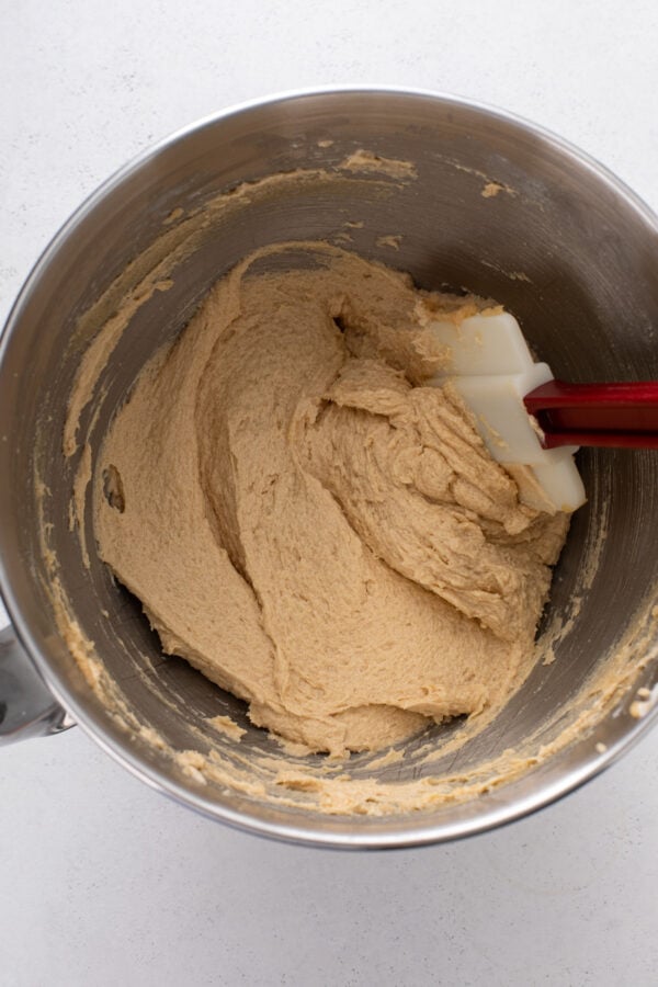 Wet ingredients for caramel apple cookies mixed in a stainless steel bowl.