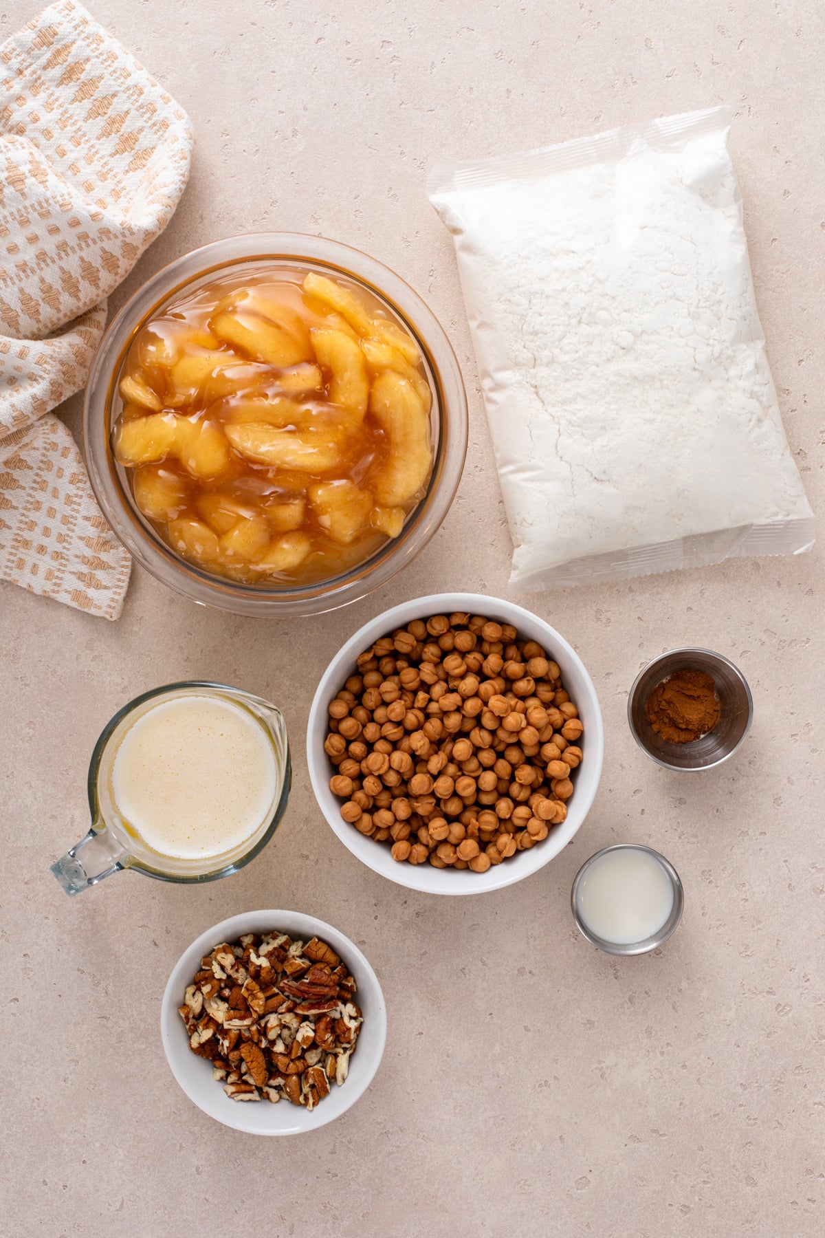 Ingredients for caramel apple dump cake arranged on a countertop.