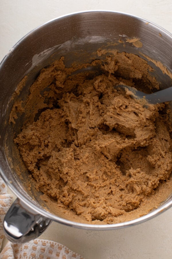 Cookie dough base for cookie butter cookies in a stand mixer bowl.