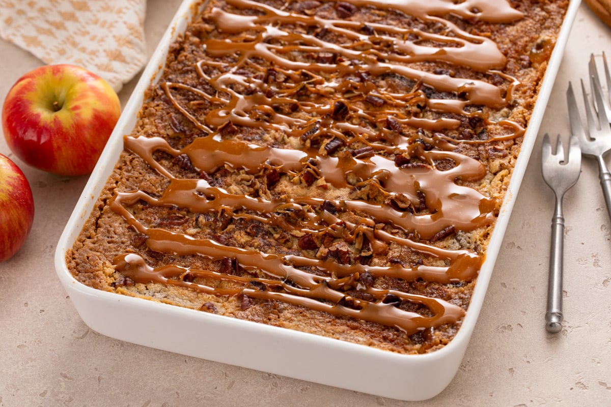 Finished caramel apple dump cake in a white baking dish.