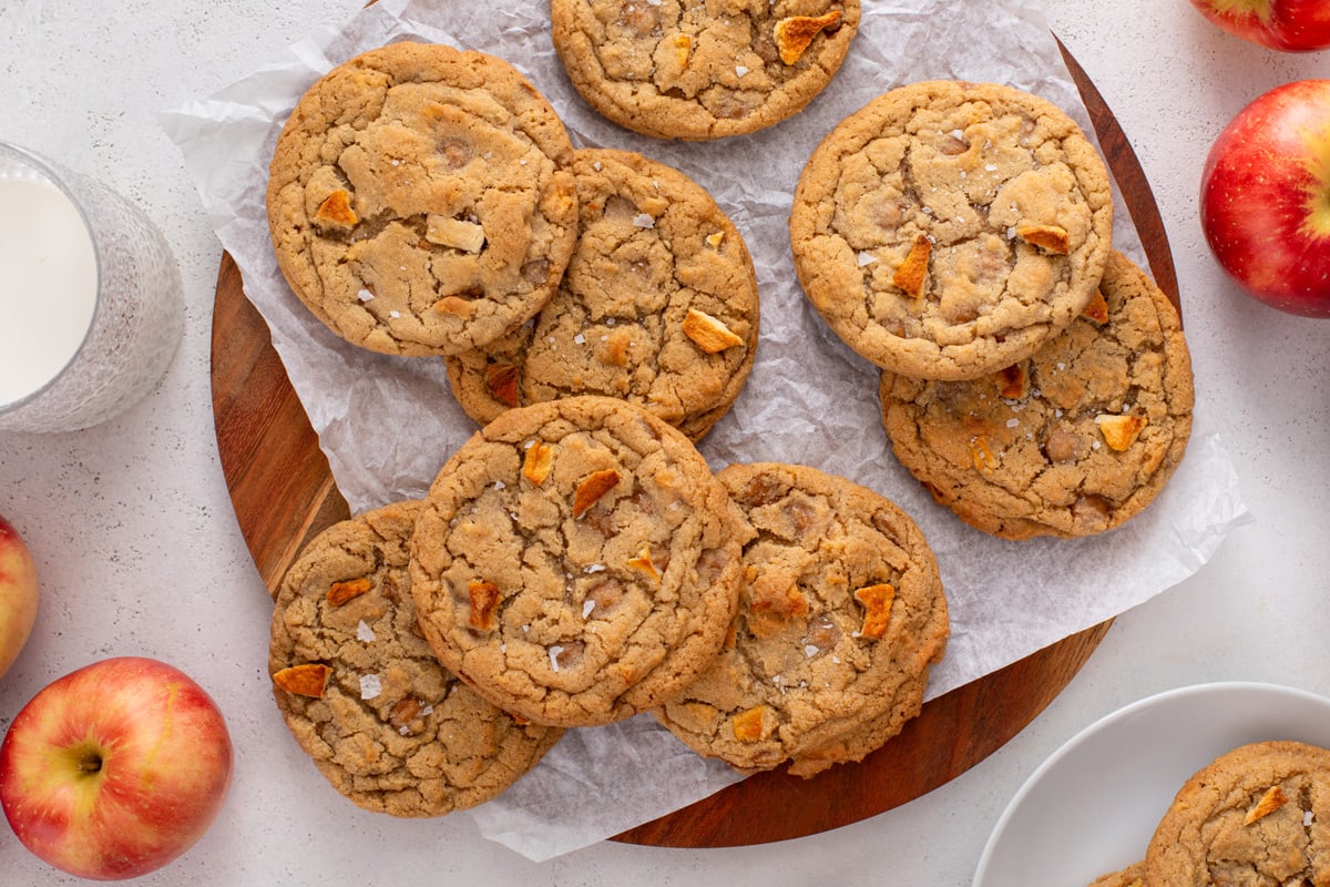 Caramel apple cookies arranged on a sheet of parchment paper.