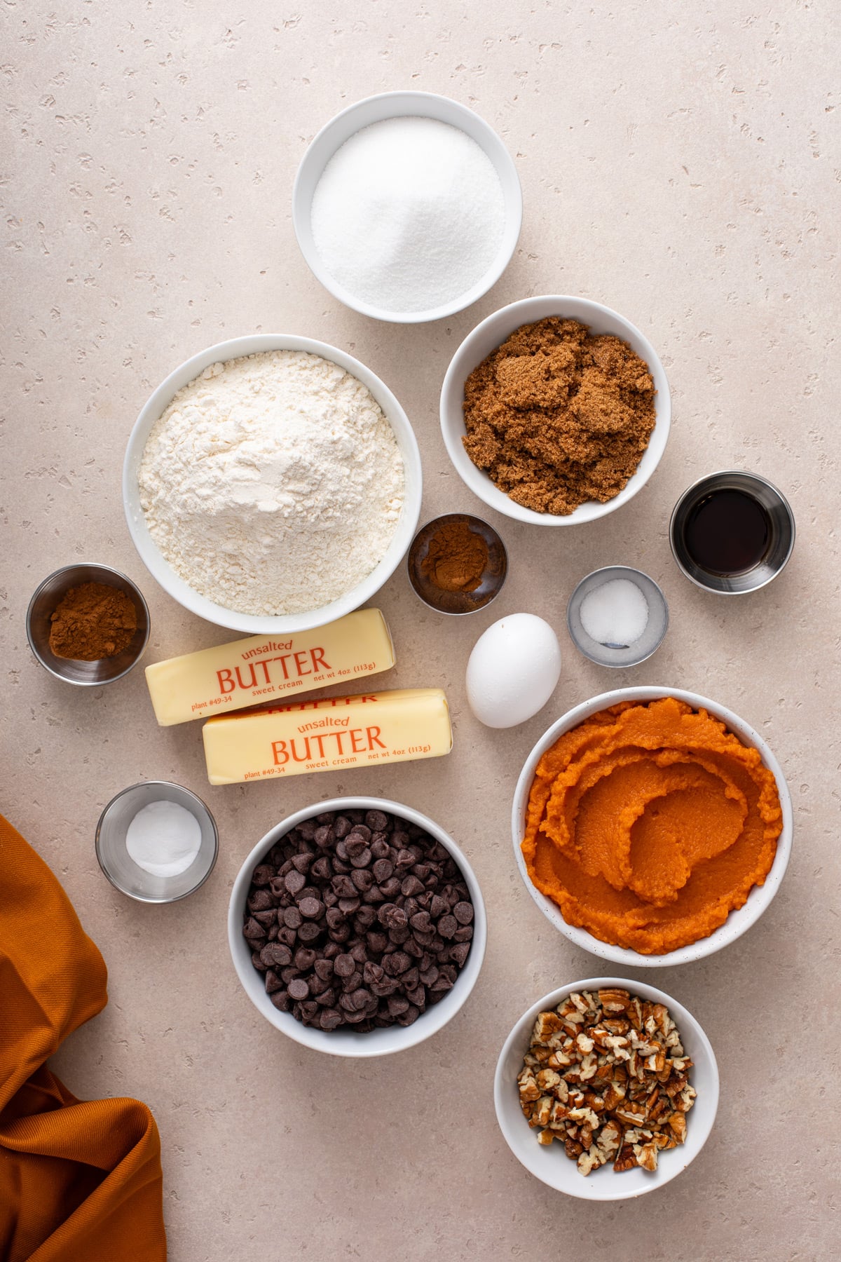 Ingredients for pumpkin snack cake arranged ona countertop.