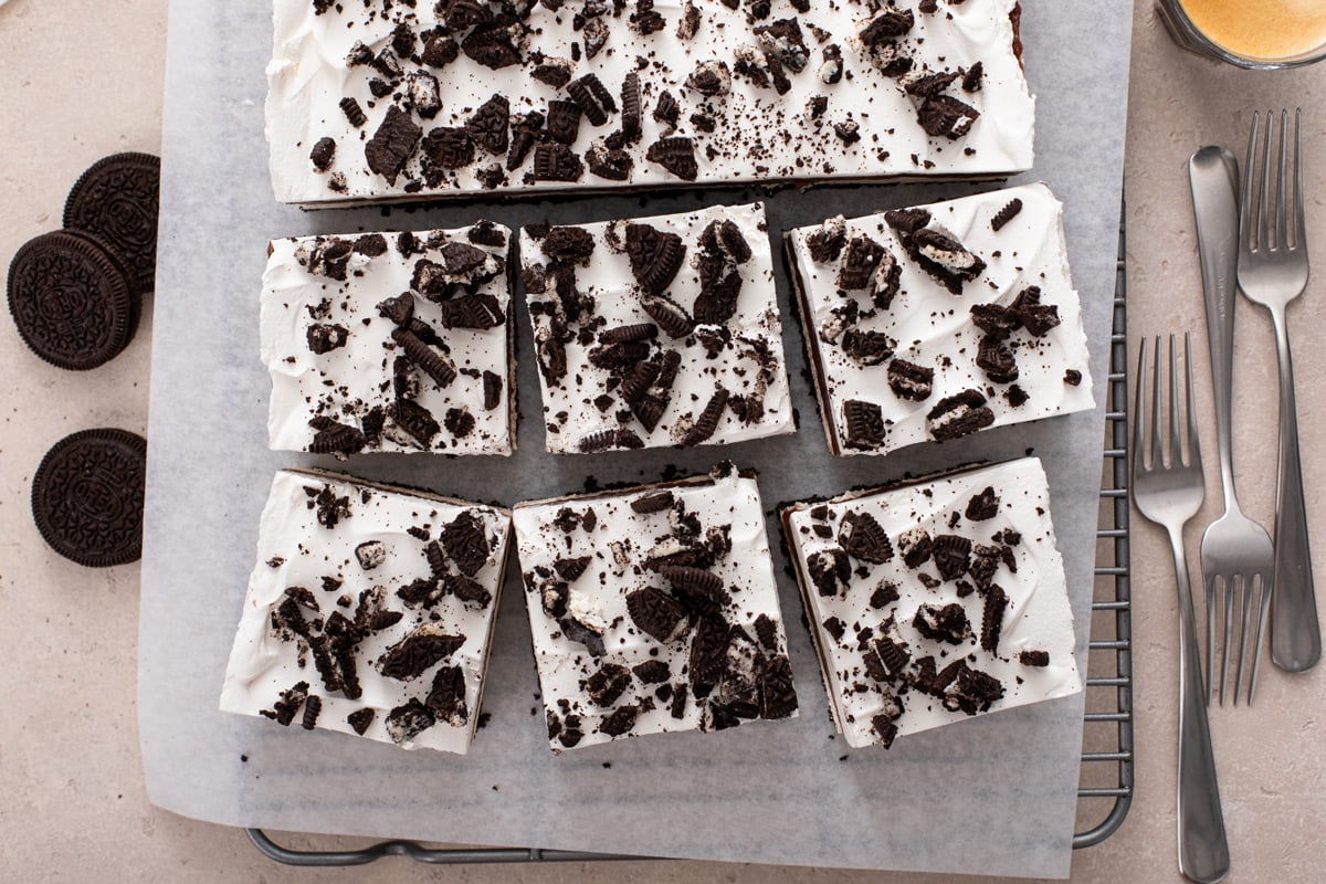 Overhead view of chilled layered chocolate pudding dessert removed from the pan and cut into slices.