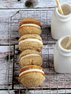 A row of banana Whoopie pies on a cooling rack