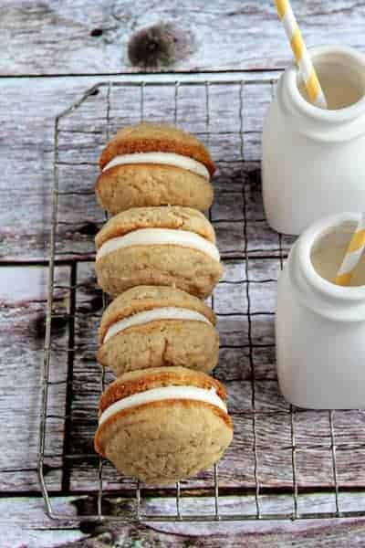 A row of banana Whoopie pies on a cooling rack