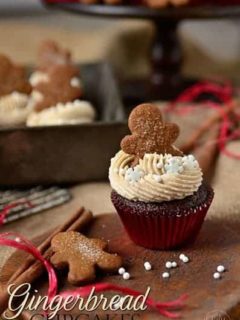Gingerbread cupcake topped with a small gingerbread man cookie