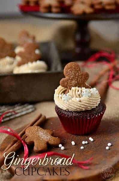 Gingerbread cupcake topped with a small gingerbread man cookie